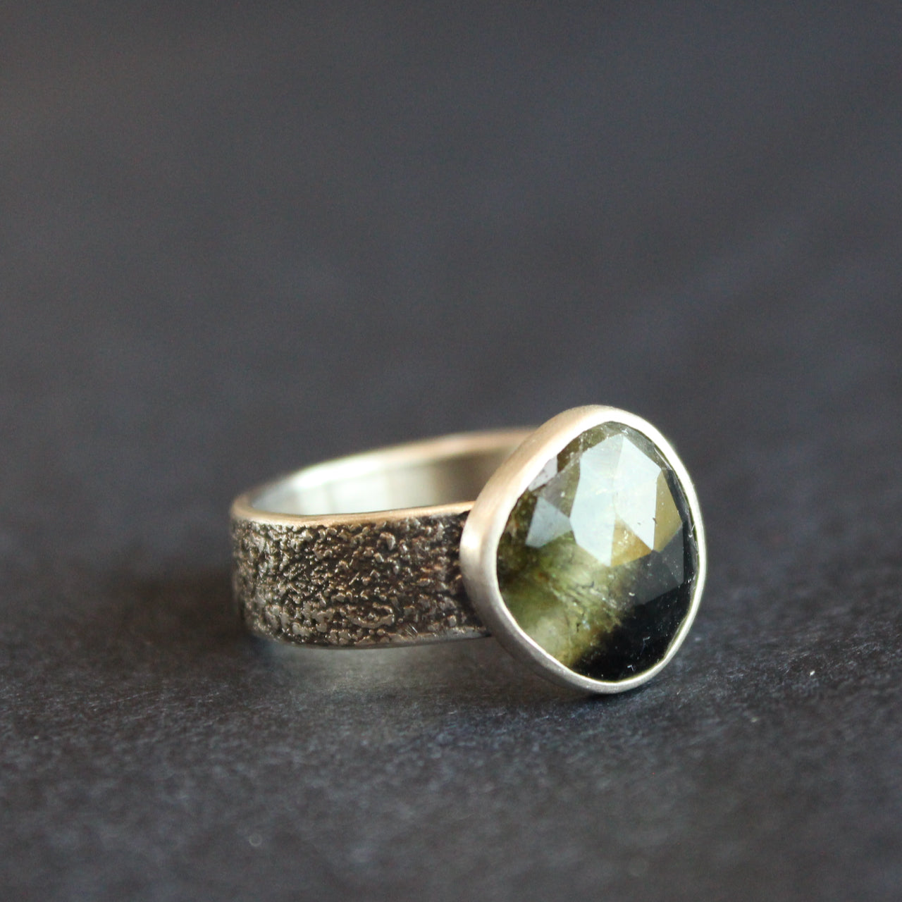 textured silver ring with a dark green stone by UK jeweller Carin Lindberg 