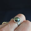 textured silver ring with a dark green stone by UK jeweller Carin Lindberg.