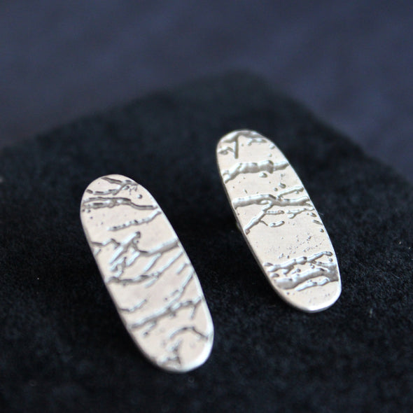 pair of long oval silver stud earrings with etched detail by Cornwall jewellery designer Carin Lindberg