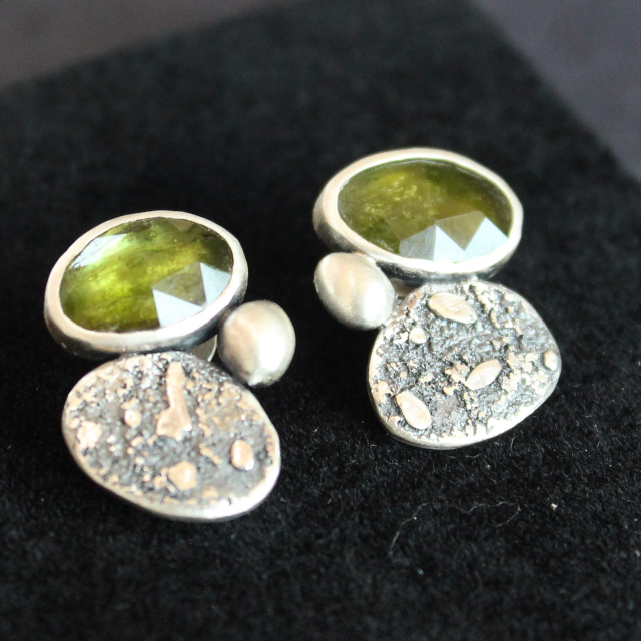silver stud earrings with a green stone set in silver by Carin Lindberg jewellery designer