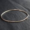 fine sliver bangle with small gold star by Cornwall jewellery designer Lucy Spink 