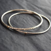 pair of narrow silver bangles by Cornwall jewellery designer Lucy Spink 