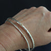 two silver bangles by Cornwall jewellery designer Lucy Spink 
