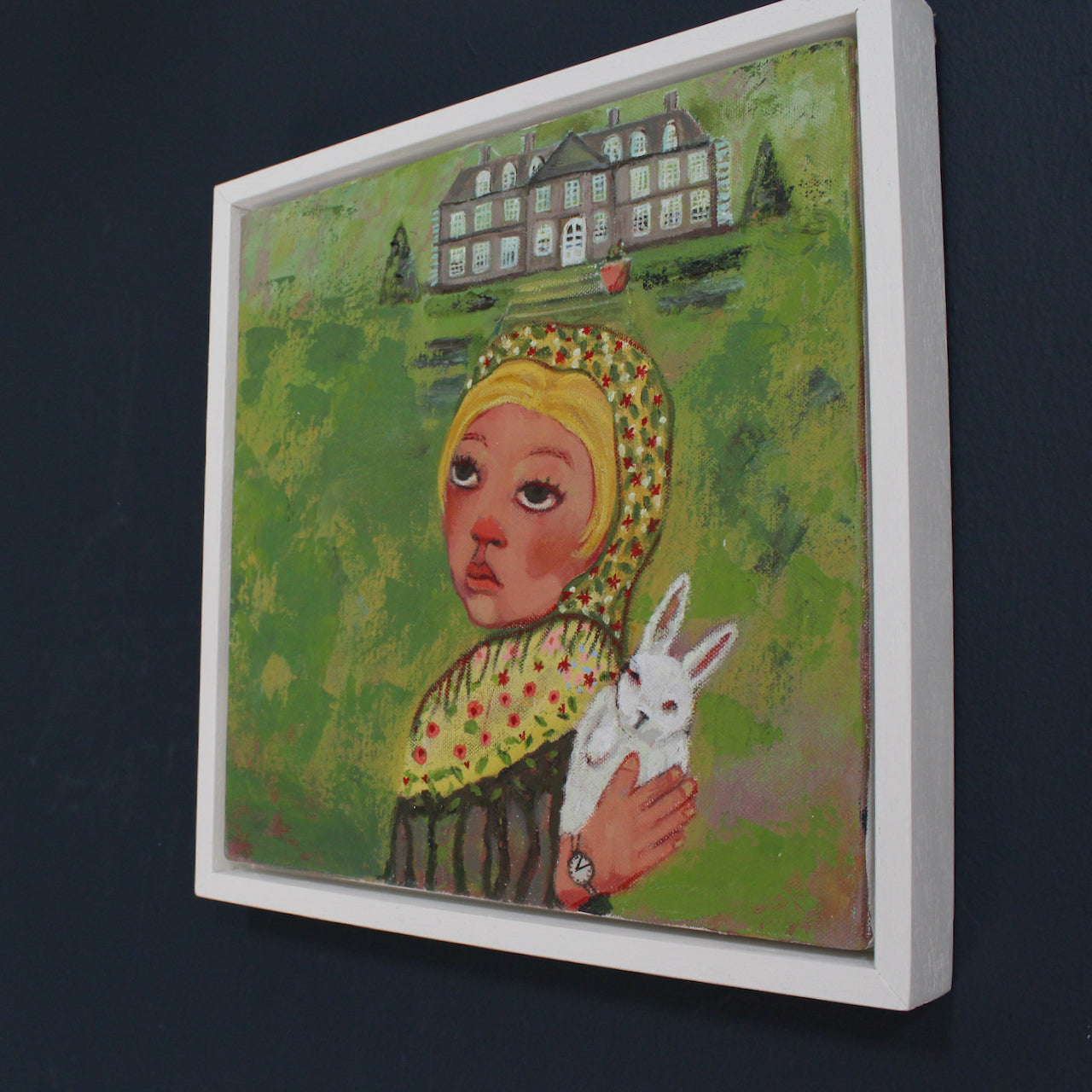 painting by Cornwall artist Siobhan Purdy of a blonde haired girl holding a rabbit standing in front of a large house and garden.
