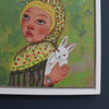 close up detail of a painting by Cornwall artist Siobhan Purdy of a blonde haired girl holding a rabbit 