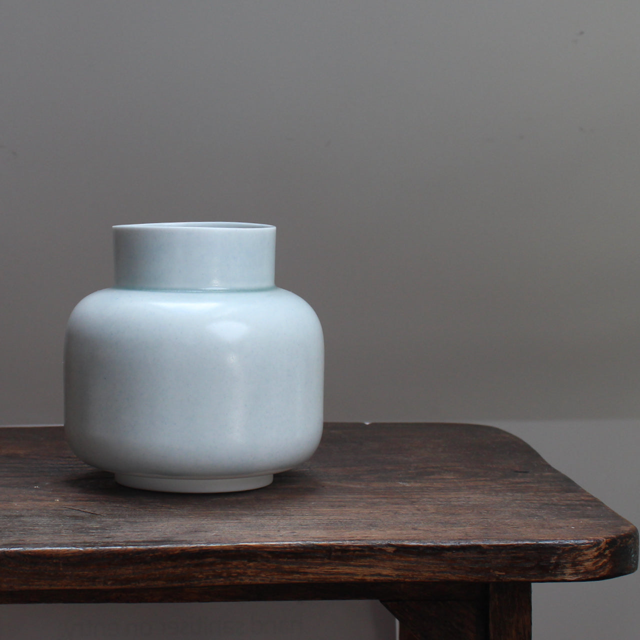 Pale Green vase on a wooden table