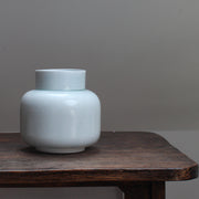 Pale Green vase on a wooden table 