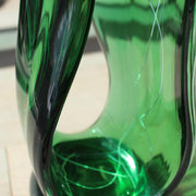 close up detail of a Benjamin Lintell glass sculpture in green with white detail 