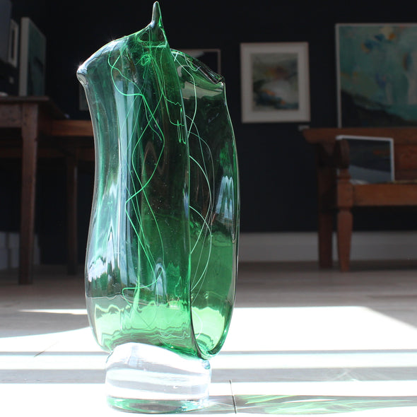 Benjamin Lintell glass sculpture in green with white detail and a clear glass base