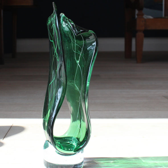 Benjamin Lintell glass sculpture in green with white line detail and a clear glass base.
