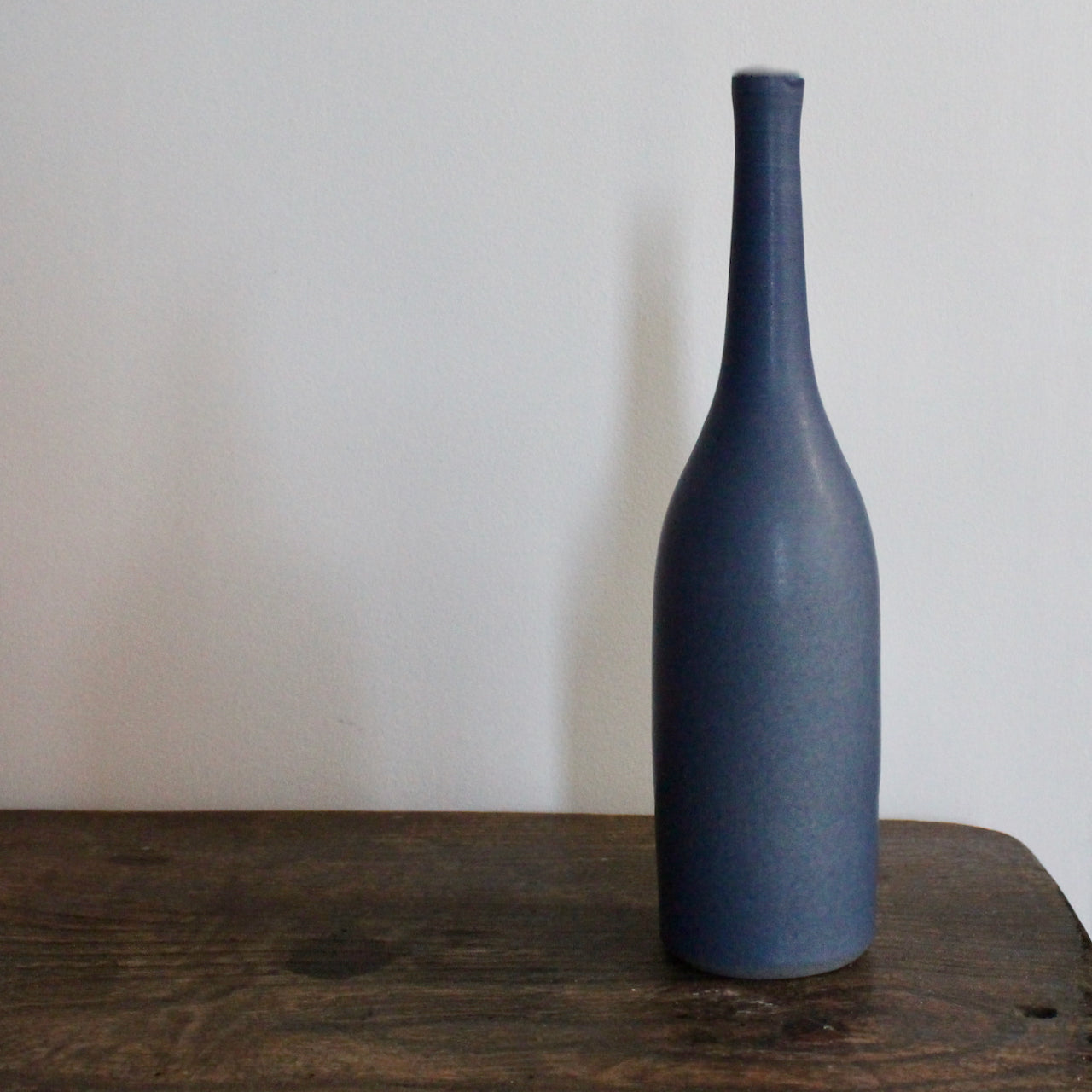 a purple coloured ceramic bottle by UK ceramic artist Lucy Burley