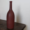 a Lucy Burley ceramic bottle in aubergine glaze.