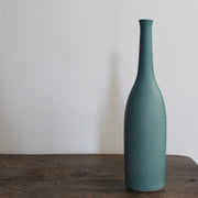 a teal coloured ceramic bottle by UK ceramicist Lucy Burley. 