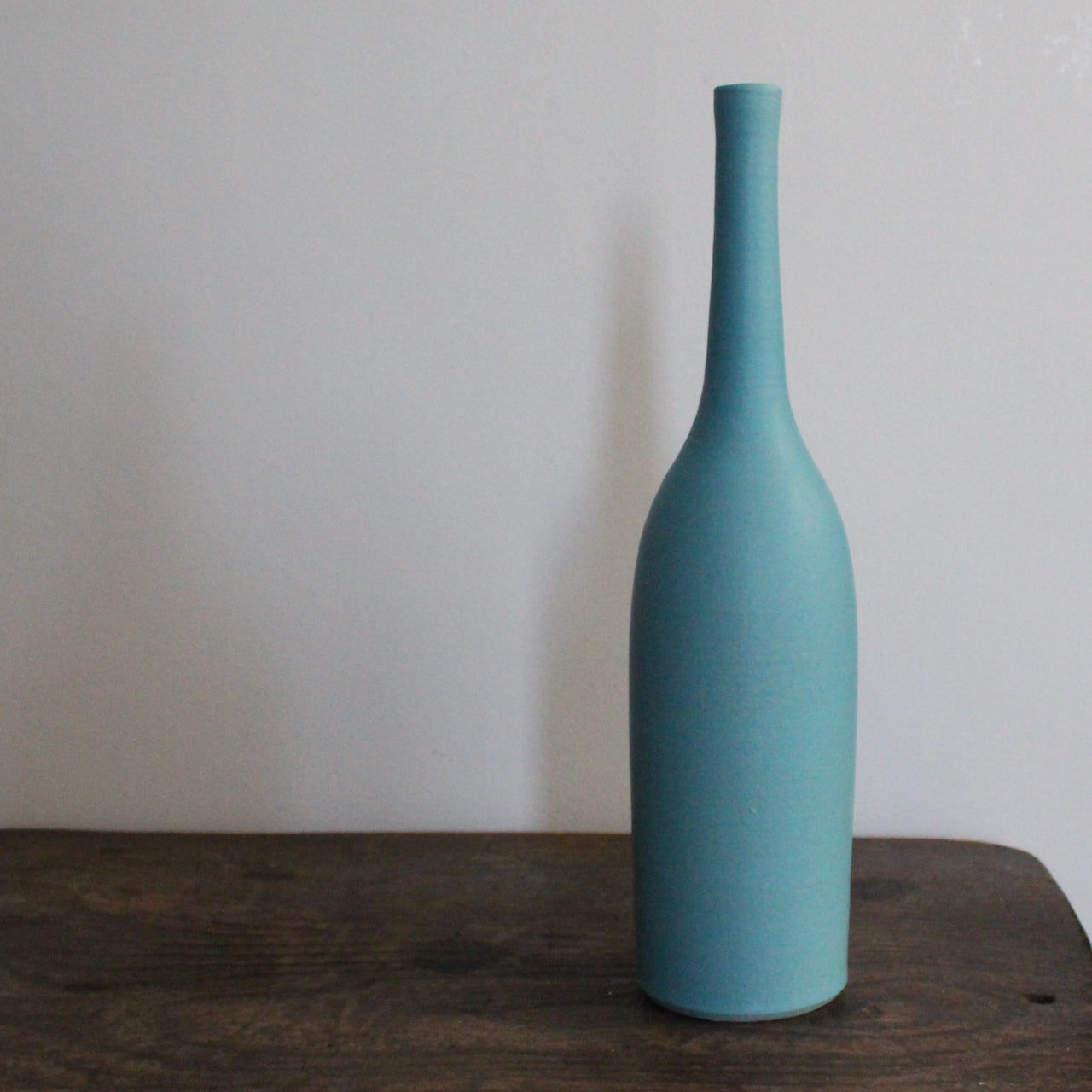 ceramic bottle by ceramic artist Lucy Burley in turquoise glaze