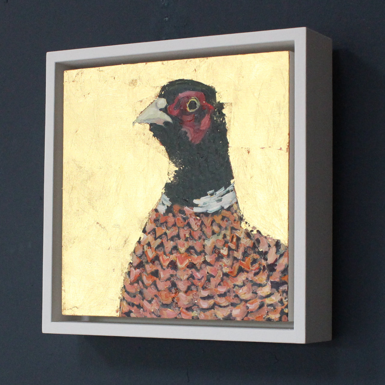 Jill Hudson painting of a pheasant on a gold background in a white frame