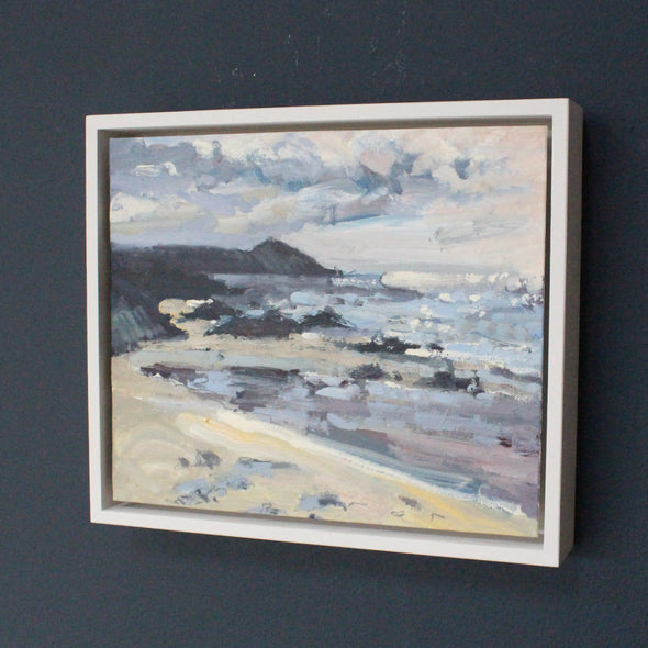 a framed Jill Hudson painting of a beach and the Rame Head headland in Cornwall  