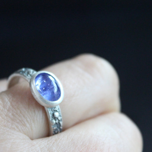 Tanzanite silver textured ring on finger by Carin Lindberg