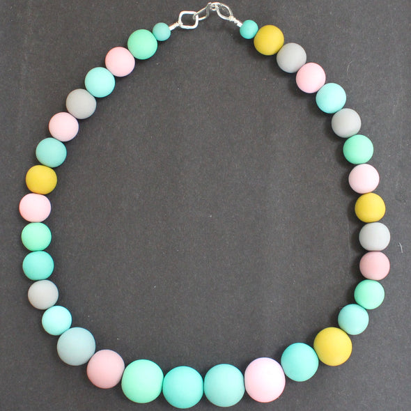 Clare Lloyd bead necklace in pastels and mustard