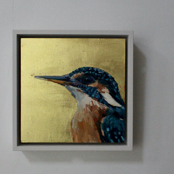 a framed Jill Hudson painting of a kingfisher on a gold leaf background 