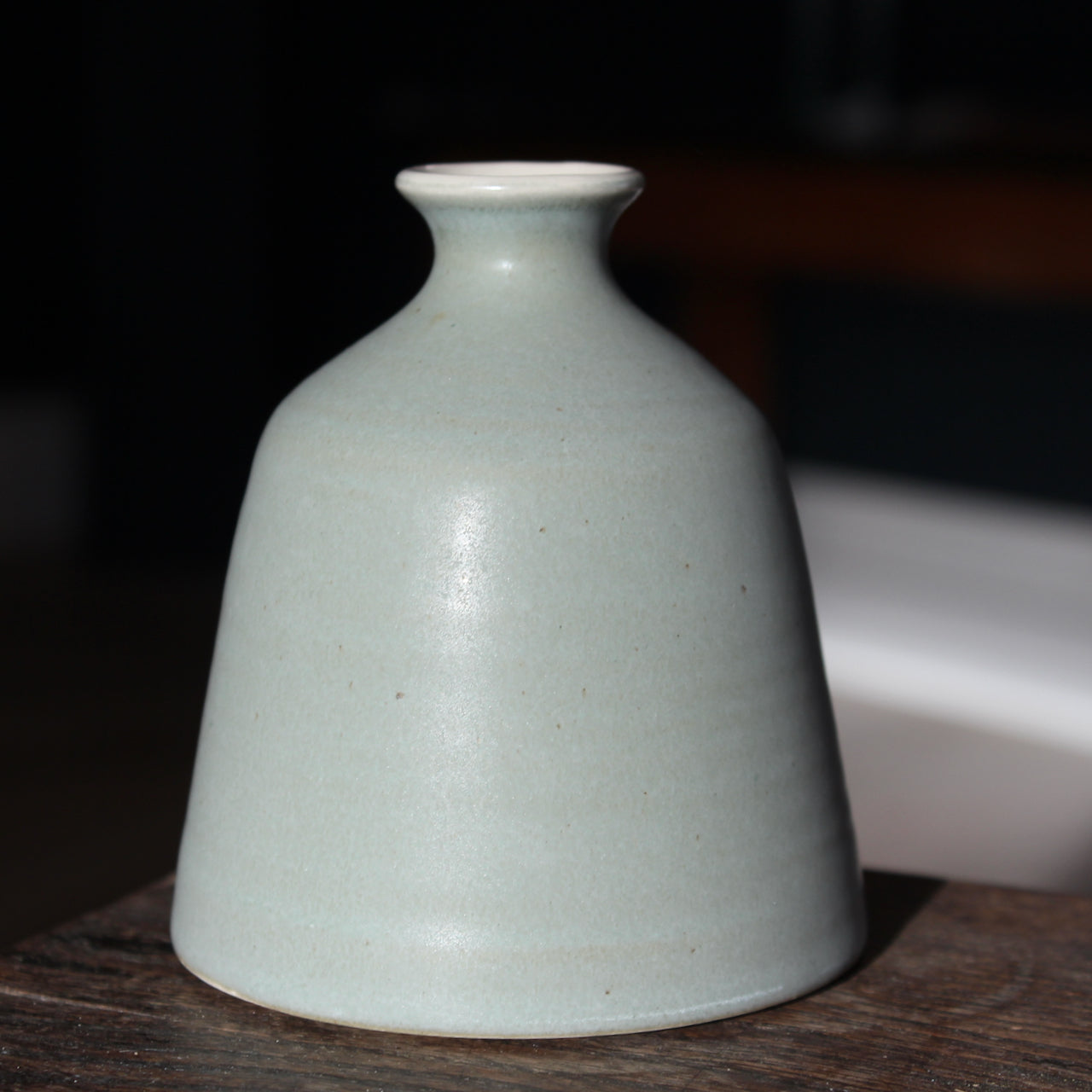 An EOT ceramics bud vase in grey grey glaze