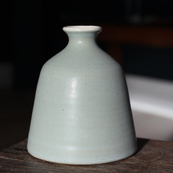 An EOT ceramics bud vase in grey grey glaze 