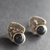 Close up of triangle stud earrings with Labradorite by Carin Lindberg