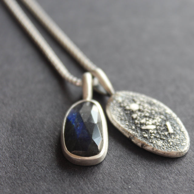 Close up of labradorite textured silver duo pendants by Carin Lindberg