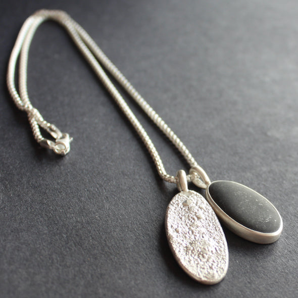 Pebble and textured silver duo pendants on silver chain by Carin Lindberg