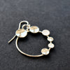 Round silver hoop earrings with small silver circles attached by Beverly Bartlett jeweller