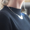 Abstract silver Ancien necklace by Beverly Bartlett on neck