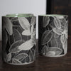  UK ceramicist Heidi Harrington trio of small ceramic beakers with a black and white photo image of leaves on the the exterior and green glazed interior 