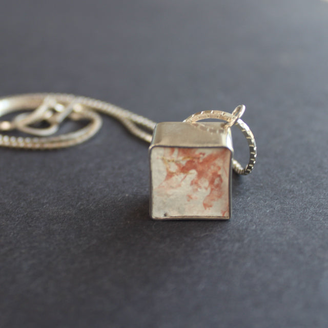 Cube pendant made from silver and cement by Amy Stringer