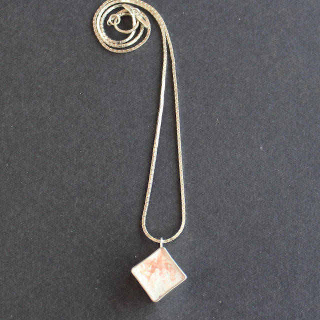 Cube pendant made from silver and cement by Amy Stringer
