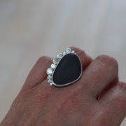 Beach pebble and silver statement ring by Carin Lindberg on finger
