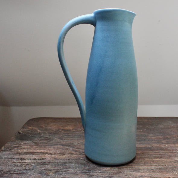 a sky Blue tall ceramic jug made by Lucy Burley.