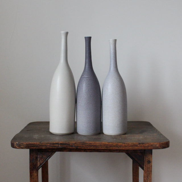 Trio of ceramic bottles in shades of grey by Lucy Burley