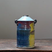 A multicoloured ceramic vase with a tapered top and small lug handles by John Pollex, leading British ceramicist,.