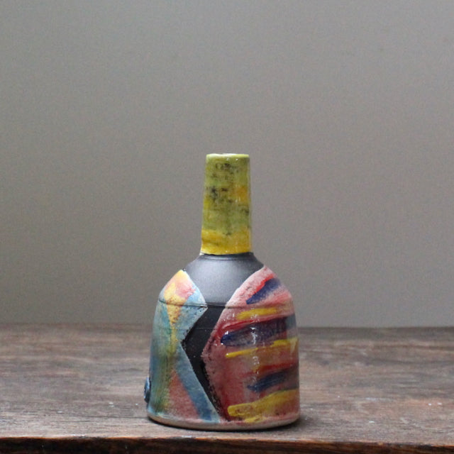 A small ceramic bottle by leading UK ceramicist John Pollex it has an abstract decoration 