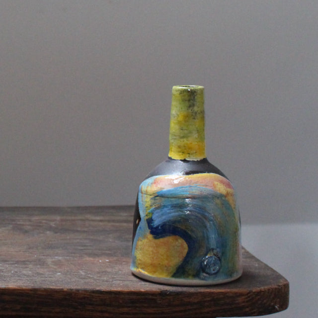 small ceramic bottle by leading UK ceramicist John Pollex it has an abstract colourful decoration.