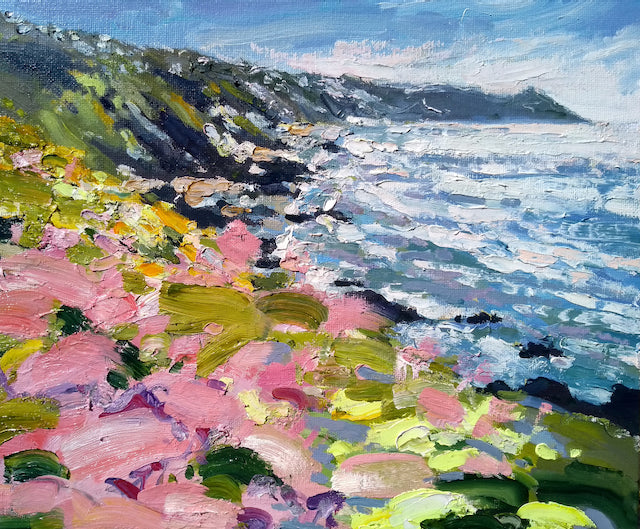 painting of Rame head in Cornwall by artist Jill Hudson showing pink flowers on a cliff next to a white and purple sea.