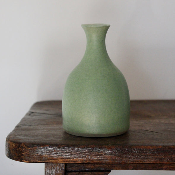 a small pale green ceramic posy vase  UK ceramicist Lucy Burley.