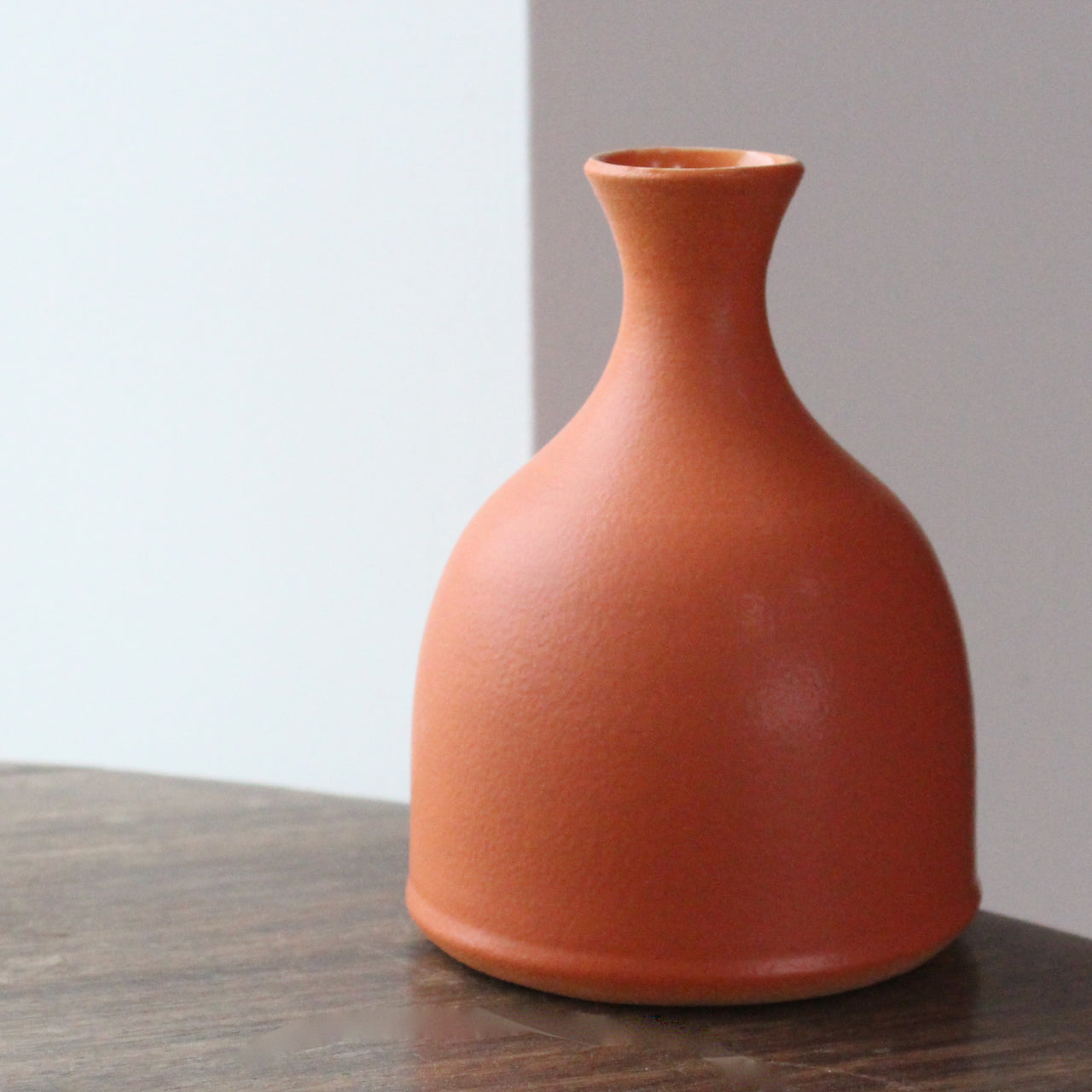 Lucy Burley small orange coloured ceramic bud vase