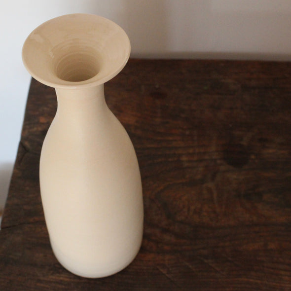 a cream coloured ceramic vase by UK ceramic artist Lucy Burley.