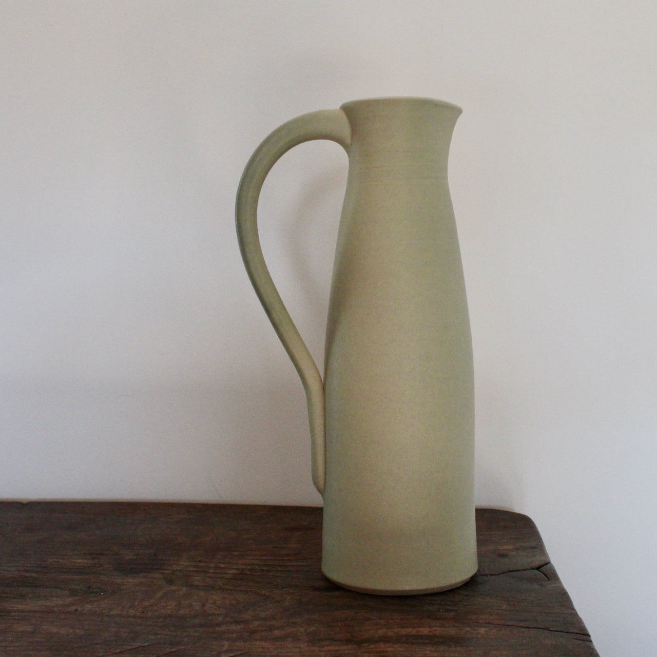 a pale olive ceramic jug by UK ceramicist Lucy Burley.