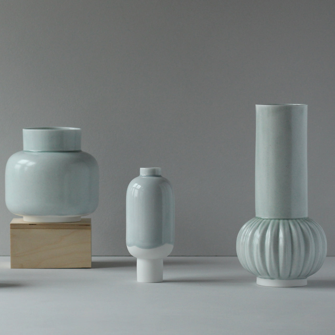 Three pale green/blue ceramic vases 