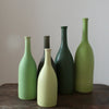 five green ceramic bottles by UK ceramicist Lucy Burley 