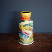 A Colourful vase by John Pollex with narrow top