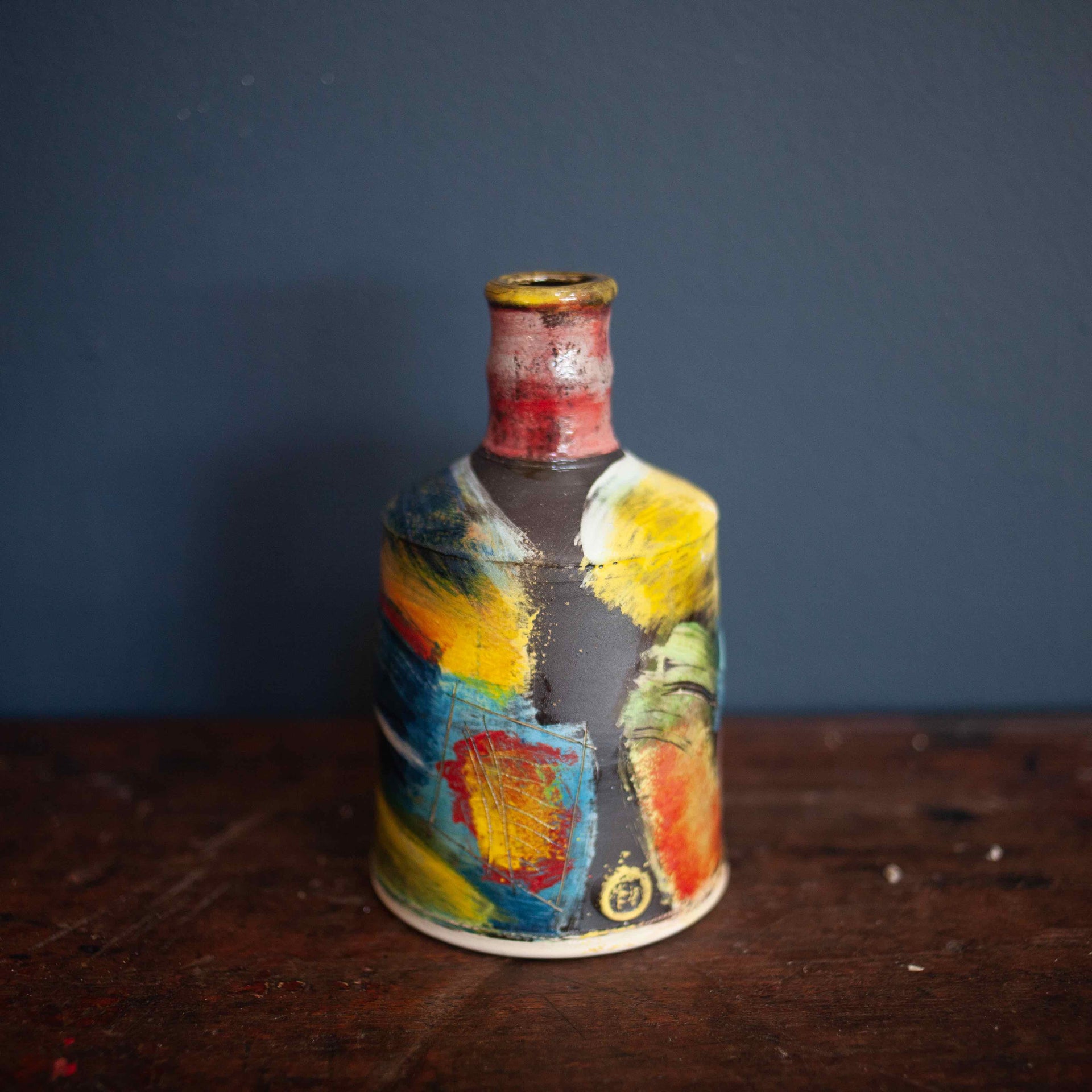 Colourful bottle made of pottery by John Pollex