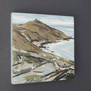 A painting of Rame Head in south east Cornwall in autumn colours with a pale blue sea and sky painted by Imogen Bone 