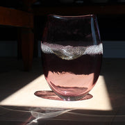purple glass vessel with centre detail by Benjamin Lintell  photographed in sunlight